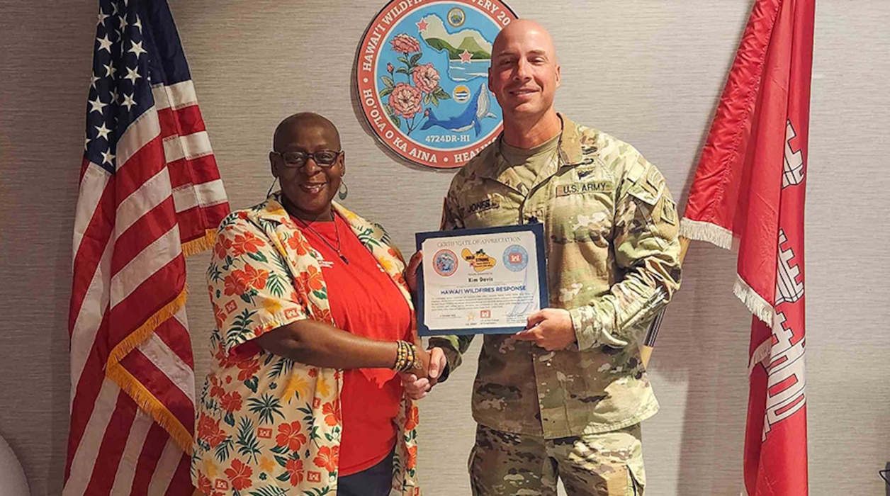 Man giving woman an award.