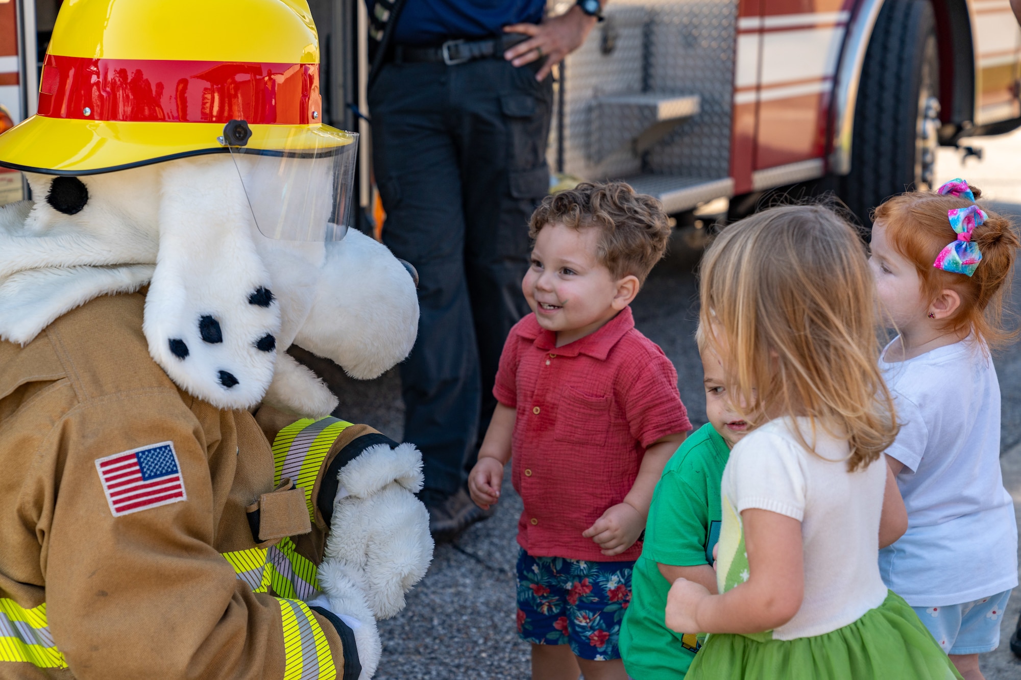 Keesler Child Development Center children meet Sparky the Fire Dog during a Fire Prevention Week demonstration at the CDC on Keesler Air Force Base, Mississippi, Oct. 9, 2024. Fire Prevention week helps raise fire safety awareness to protect homes and families. (U.S. Air Force photo by Andrew Young)