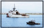 Members of Port Security Unit 301from Cape Cod, Mass., and deployed to Naval Station Guantanamo Bay, escort the Coast Guard Cutter Thetis in the waters of Guantanamo Bay.
