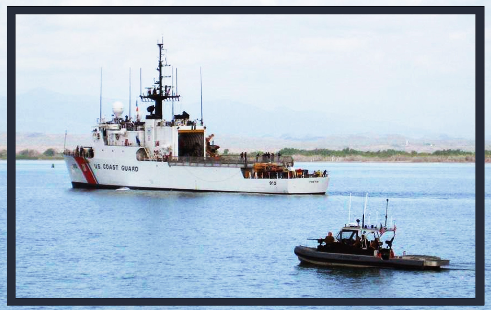 Members of Port Security Unit 301from Cape Cod, Mass., and deployed to Naval Station Guantanamo Bay, escort the Coast Guard Cutter Thetis in the waters of Guantanamo Bay.