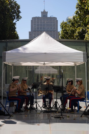 U.S. Marines with 1st Marine Division Band perform at Salesforce Park Amphitheater as part of San Francisco Fleet Week 2024 in San Francisco, Oct. 8, 2024. SFFW, now in its 43rd iteration, is a time-honored sea service celebration that allows citizens of the Bay Area to witness today’s maritime capabilities firsthand. Nearly 2,500 Sailors, Marines, and Coast Guardsmen will showcase their capabilities and equipment, participate in various community service events, and enjoy the hospitality of the Bay Area during the event. (U.S. Marine Corps photo by Cpl. Bruin Largent)