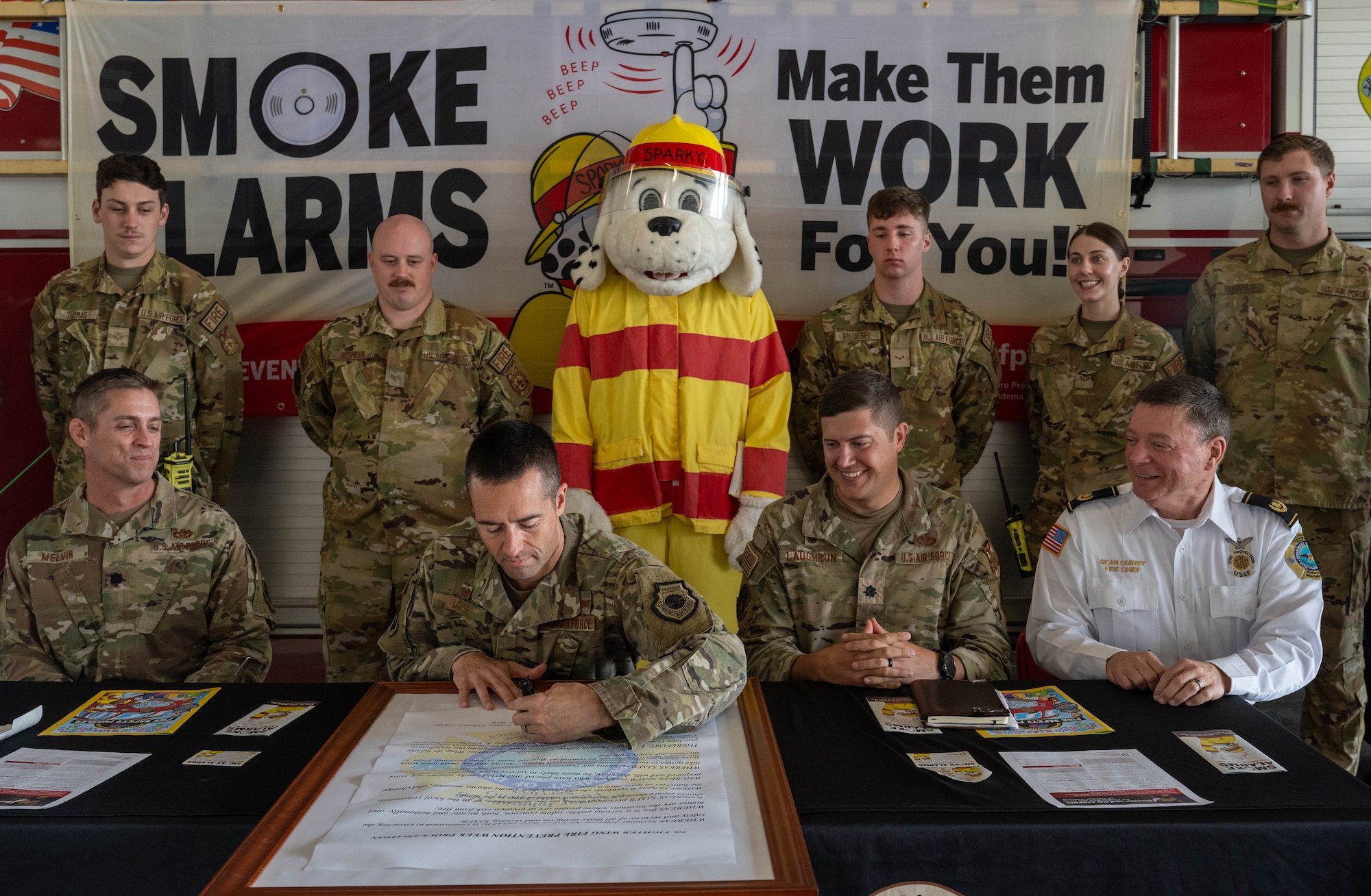 U.S. Air Force Col. Morgan Lohse, 4th Fighter Wing commander, signs the 2024 Fire Prevention Proclamation at Seymour Johnson Air Force Base, North Carolina, Oct. 1, 2024. The theme for 2024 Fire Prevention Week stresses the importance of having a functional smoke alarm to increase the chance of survival during a house fire. (U.S. Air Force photo by Airman 1st Class Rebecca Tierney)