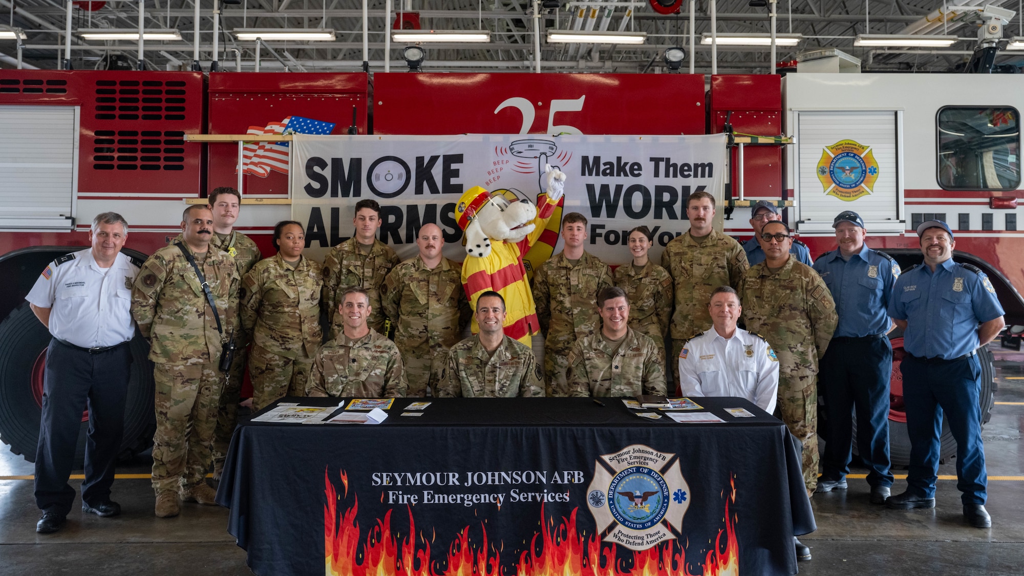 U.S. Air Force Col. Morgan Lohse, 4th Fighter Wing commander, and members of the 4th Civil Engineer Squadron fire station pose for a photo after signing the 2024 Fire Prevention Proclamation at Seymour Johnson Air Force Base, North Carolina, Oct. 1, 2024. The theme for 2024 Fire Prevention Week stresses the importance of having a functional smoke alarm to increase the chance of survival during a house fire. (U.S. Air Force photo by Airman 1st Class Rebecca Tierney)