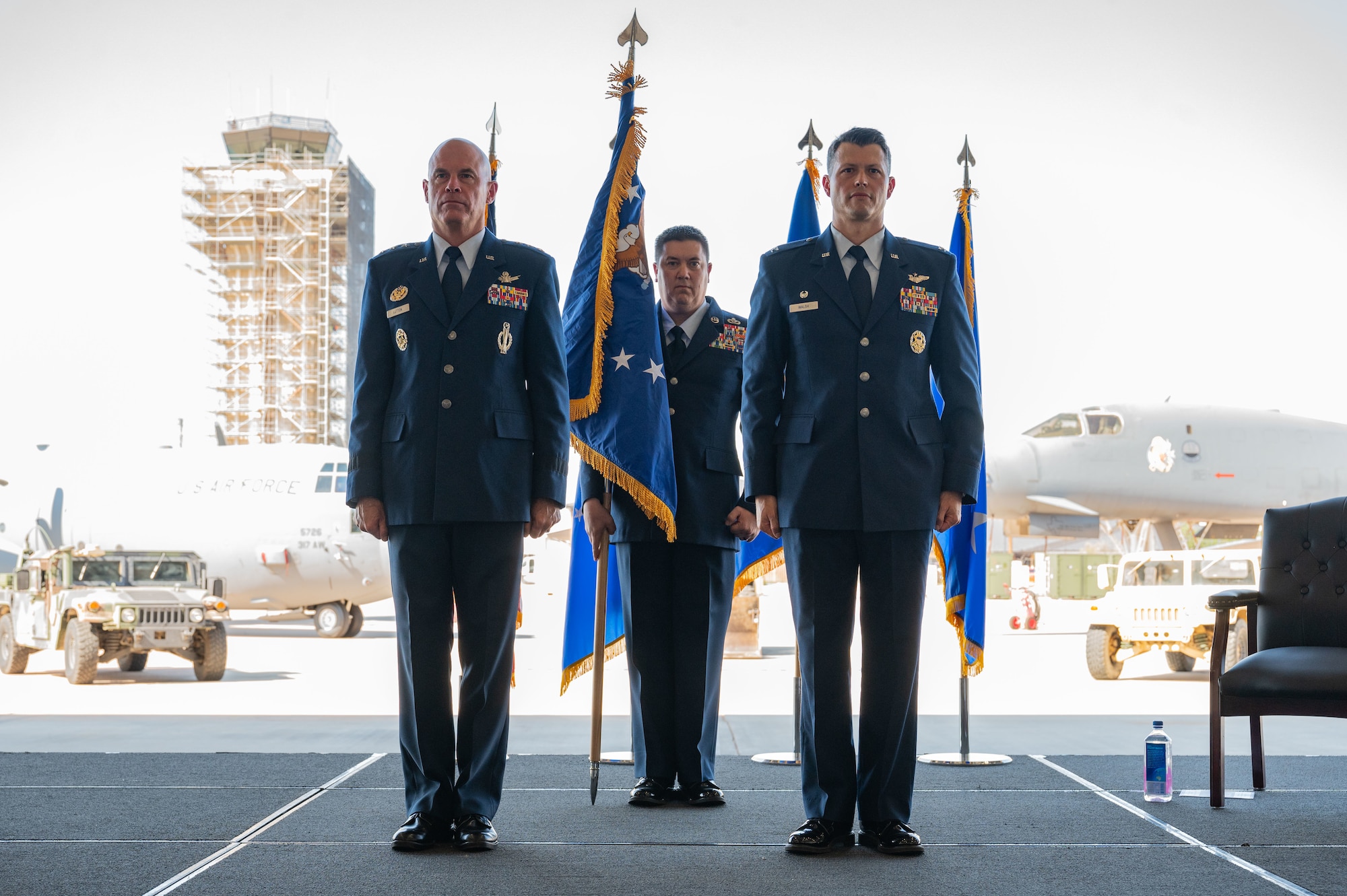 U.S. Air Force Lt. Gen. Michael Lutton, Air Force Global Strike Command deputy commander and Col. Thomas Walsh, 21st Air Task Force commander, stand at attention during the 21st ATF assumption of command at Dyess Air Force Base, Texas, Oct. 8, 2024. Along with integrating the 21st ATF, the 21st Combat Air Base Squadron will be stood up at Dyess as part of the pilot program. (U.S. Air Force photo by Airman 1st Class Emma Anderson)