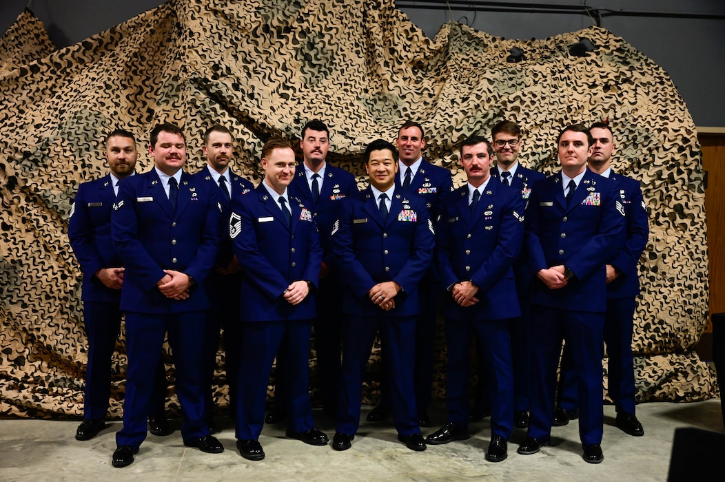 Members assigned to the 19th Civil Engineer Squadron poses for group picture