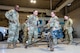 Airmen from the 91st Security Forces Group brief Chief Master Sgt. Travis Chadick, Air Force Nuclear Weapons Center command chief, on the weapon systems utilized by Security Forces at Minot Air Force Base, North Dakota, Oct. 3, 2024. Chadick visited to mentor Airmen and learn firsthand Minot AFB’s unique dual nuclear wing mission. (U.S. Air Force photo by Senior Airman Alexander)