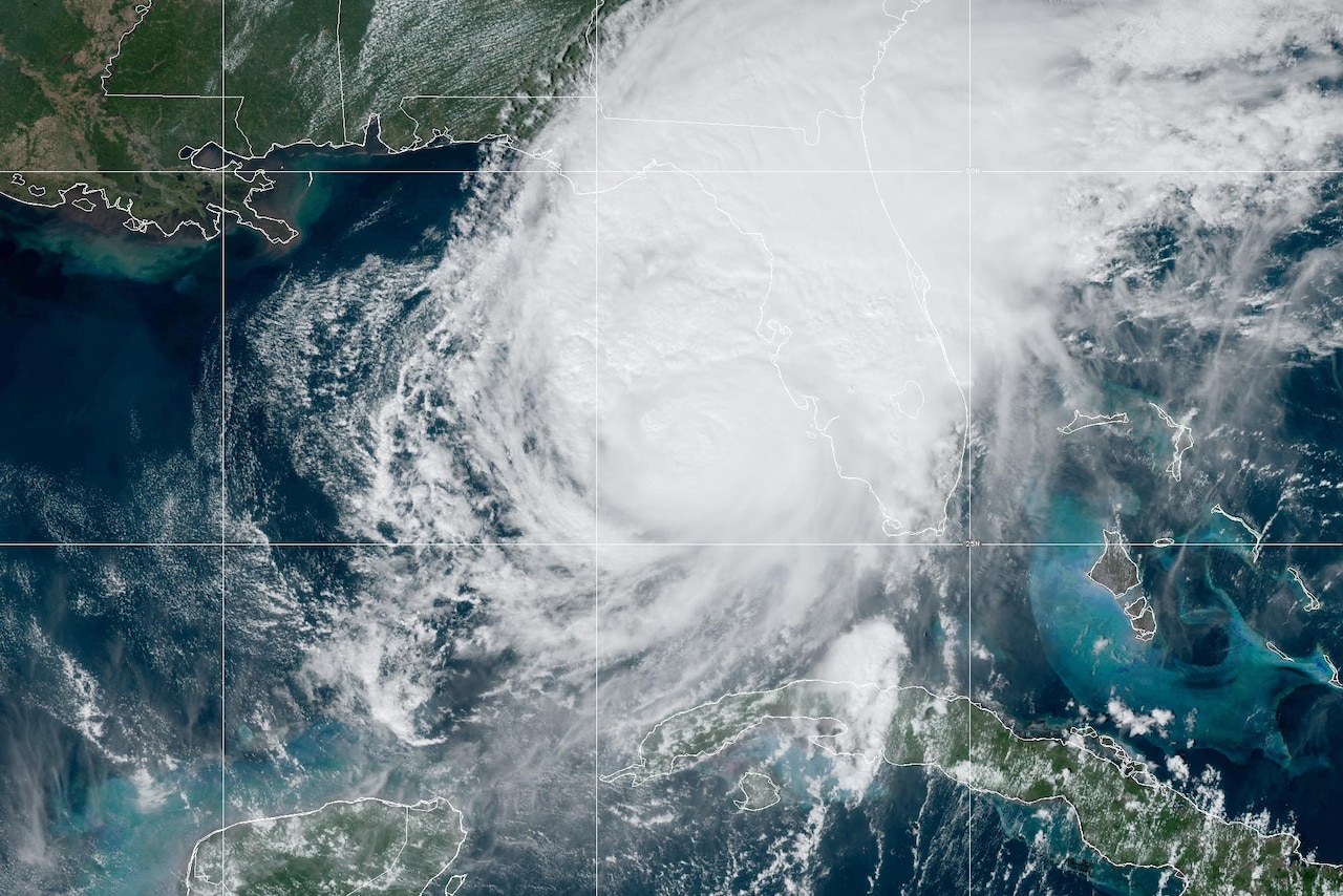 A satellite image of a hurricane next to the Florida panhandle.