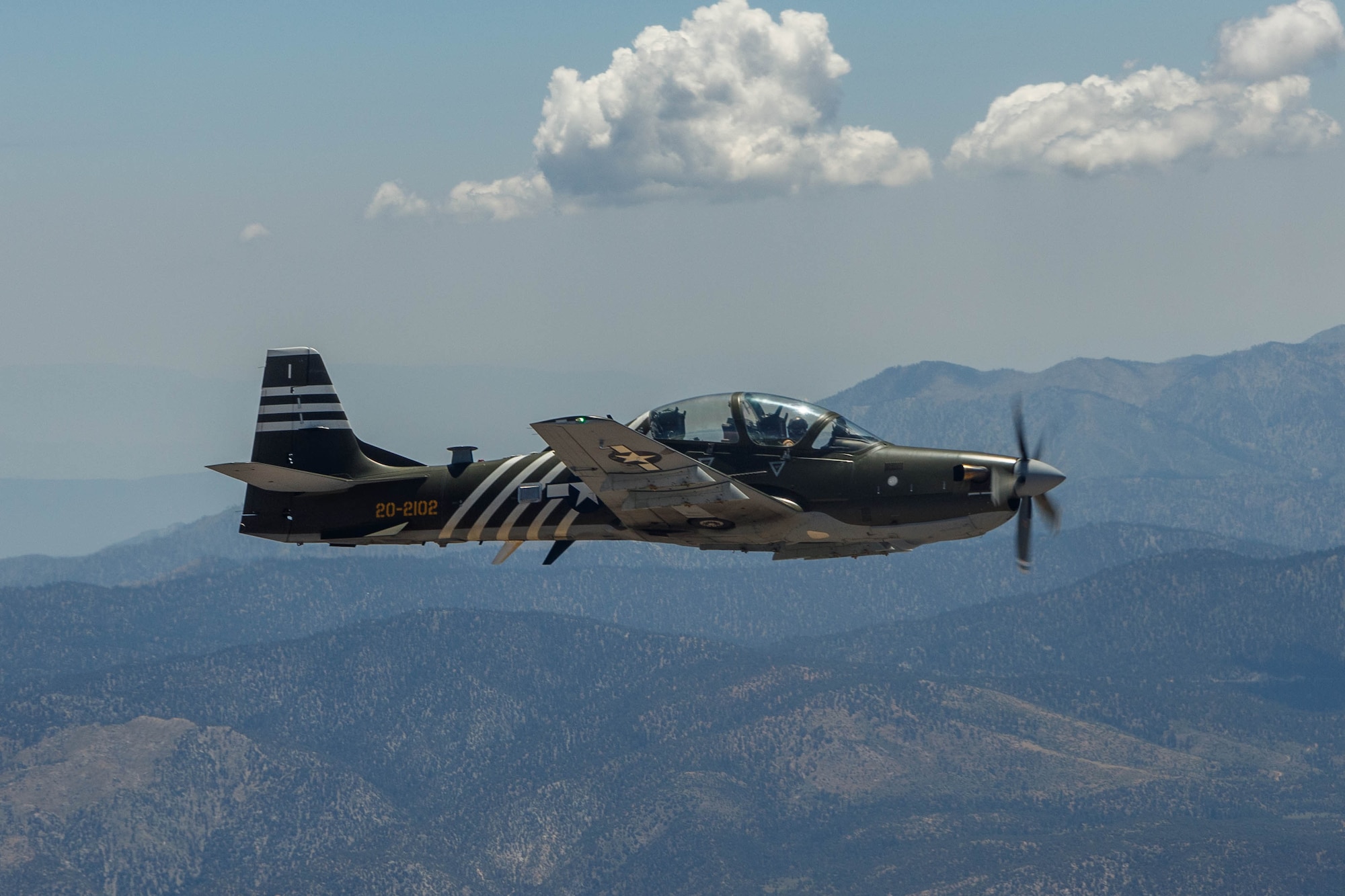 An A-29 Super Tucano conducts a ferry flight to Edwards Air Force Base, California, July 18, it they will join a unique fleet at the U.S. Air Force Test Pilot School. (Air Force photo by Richard Gonzales)