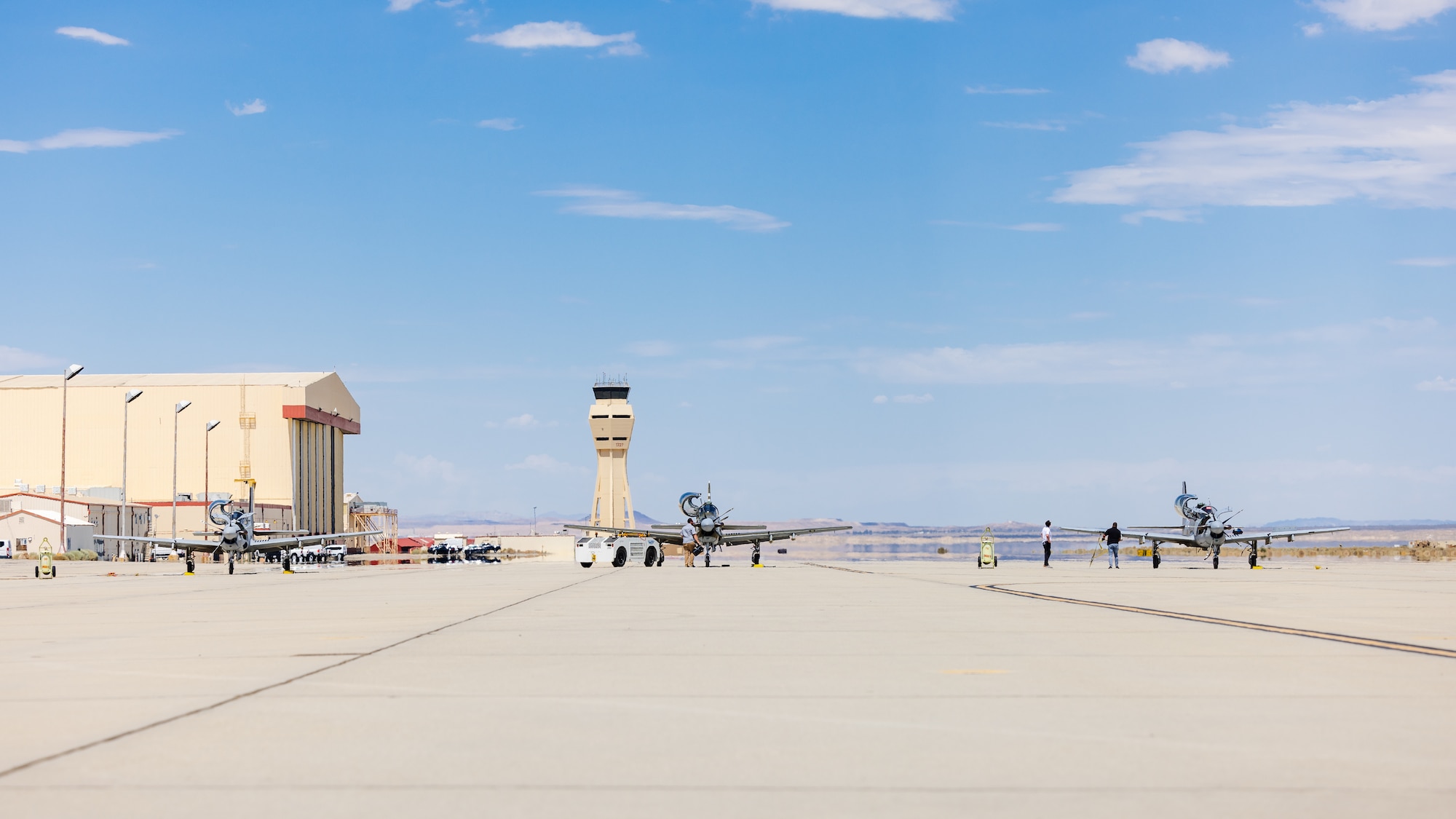 Three A-29 Super Tucanos arrive at Edwards Air Force Base, California, July 18, where they will join a unique fleet at the U.S. Air Force Test Pilot School. (Air Force photo by Lindsey Iniguez)
