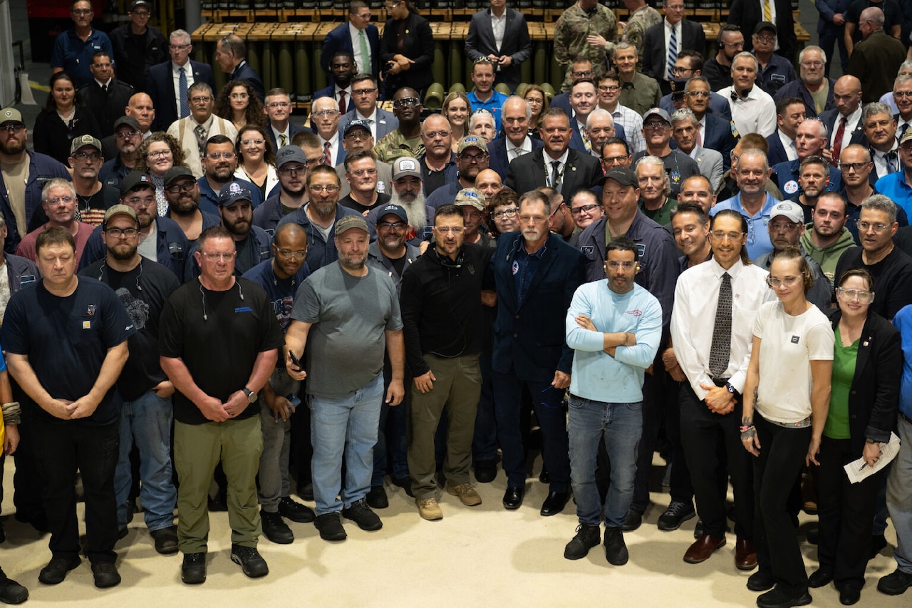 A large group of people pose for a photo.