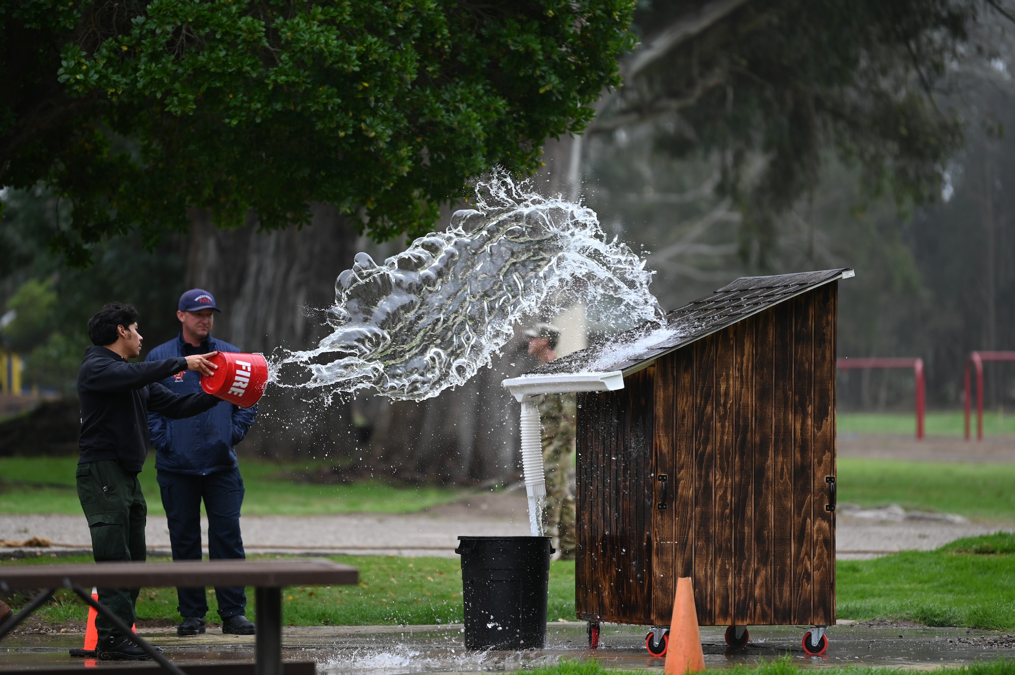 vandenberg base members participate in many events during a fire muster competition, events including pulling a truck, a water bucket challenge,