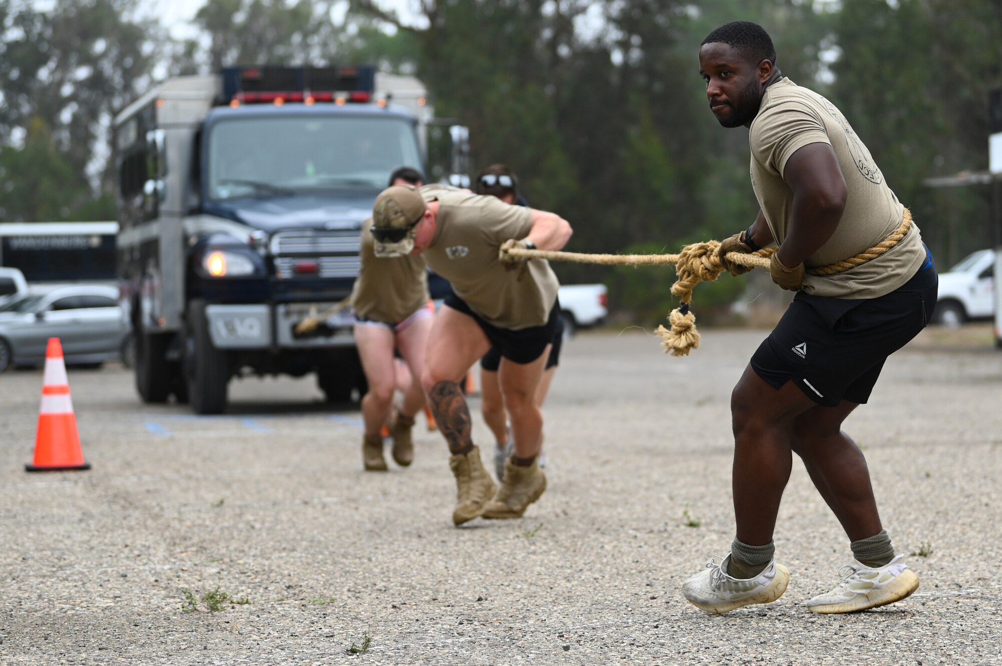 vandenberg base members participate in many events during a fire muster competition, events including pulling a truck, a water bucket challenge,
