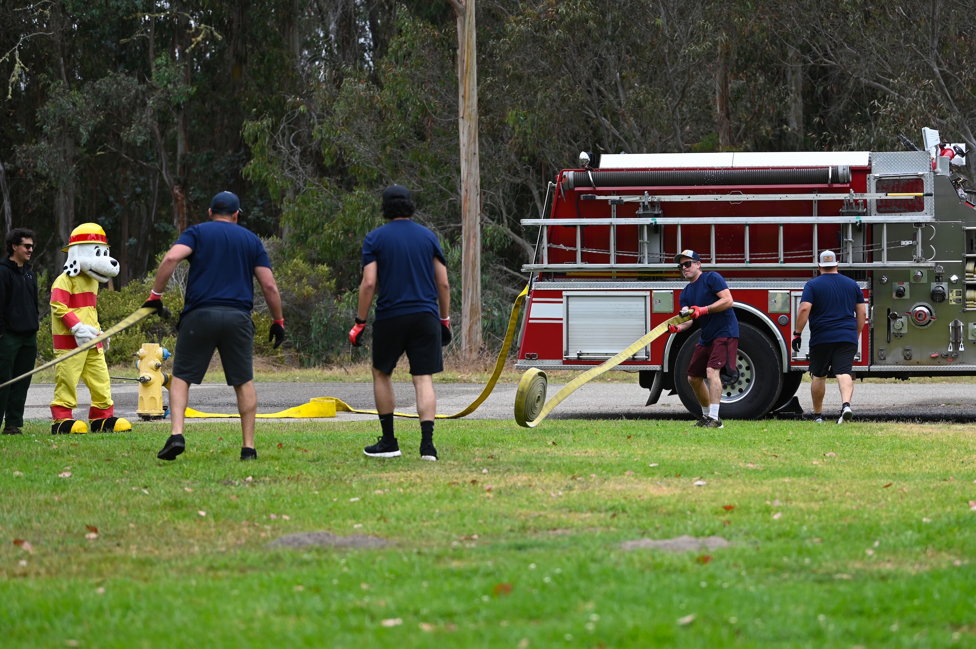 vandenberg base members participate in many events during a fire muster competition, events including pulling a truck, a water bucket challenge,