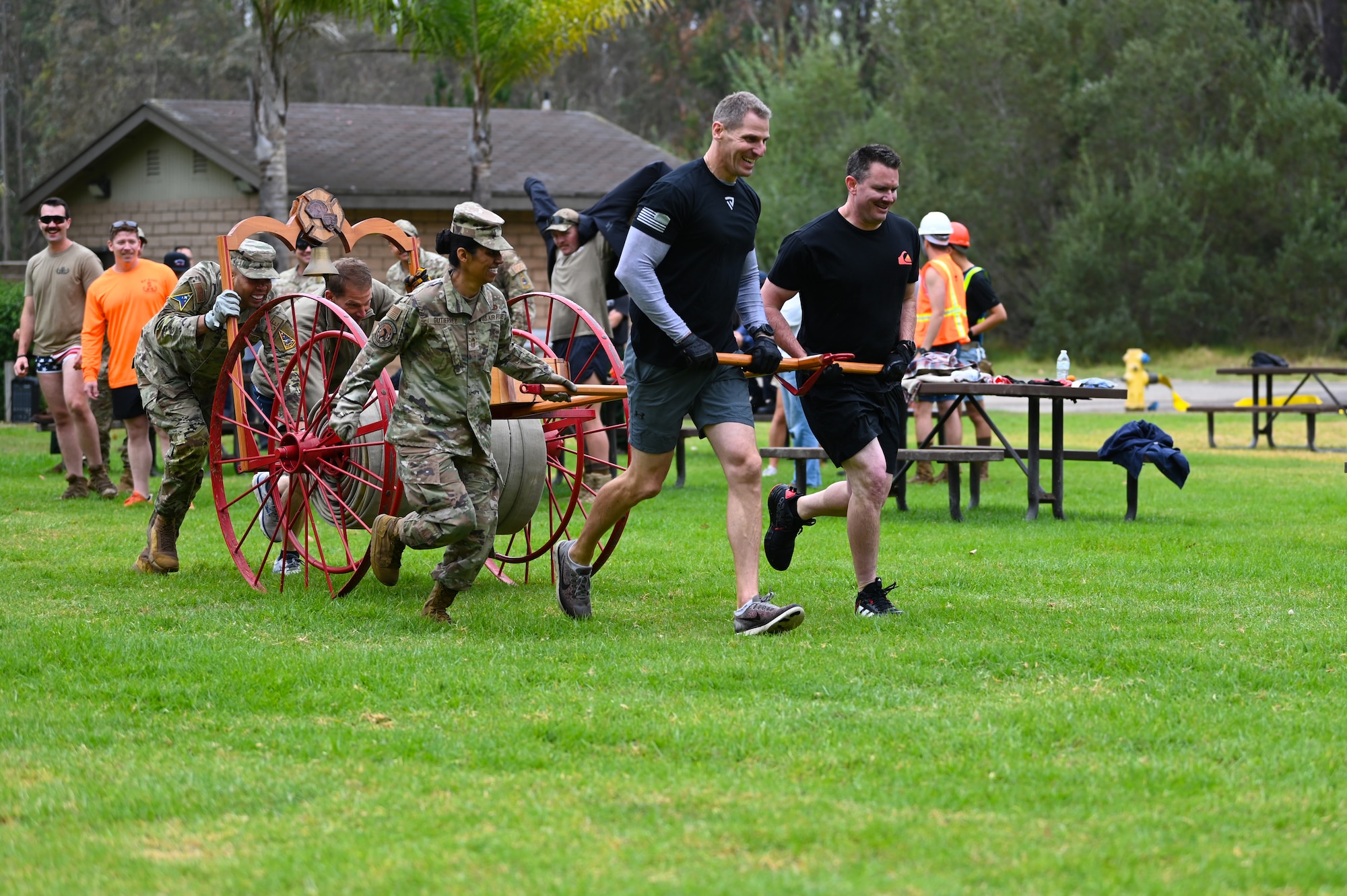 vandenberg base members participate in many events during a fire muster competition, events including pulling a truck, a water bucket challenge,