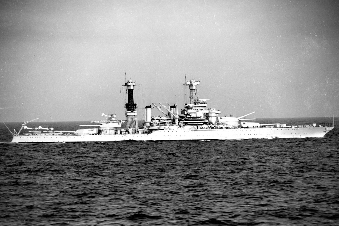 Black and white image of a battleship at sea.