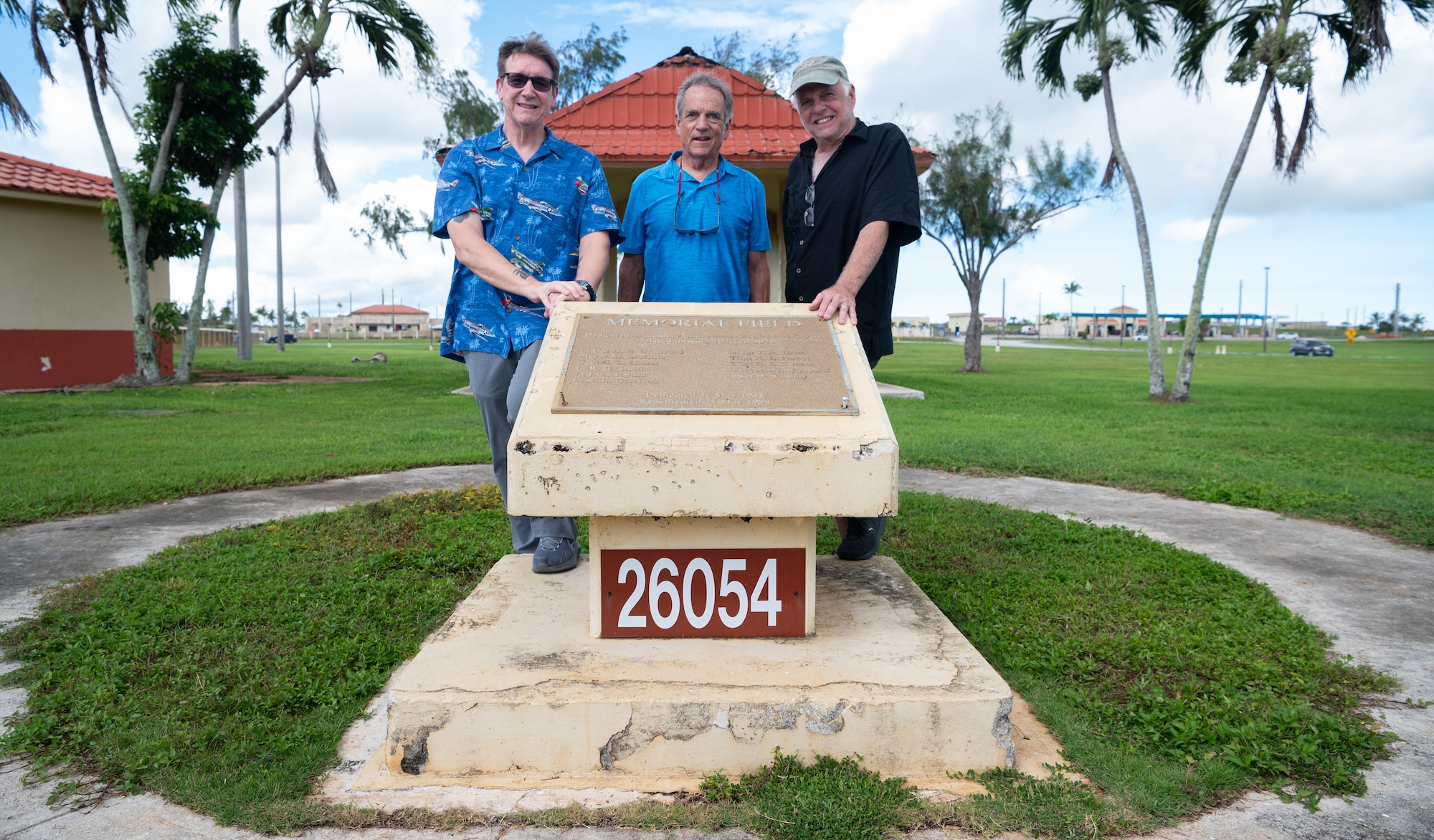 Jeff Richard McGhie, left, and his brother Kevin Wright pose for a photo with a plaque listing the names of B-29 #44-61700 crew members at the Memorial Field on Andersen Air Force Base, Guam, August 26, 2024. Jeff McGhie's father, Richard McGhie Jr., was the co-pilot of B-29 #44-61700. During a training flight the B-29 went missing. Jeff was only a year old at the time. 77 years later, Jeff finally made it to Guam to see the Memorial that was dedicated to his father and crew following the tragic incident. (U.S. Air Force photo by Staff Sgt. Pedro Tenorio)
