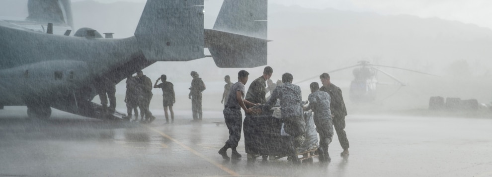 241008-M-LO557-1286 BASCO, Philippines (Oct. 8, 2024) U.S. Marines assigned to the 15th Marine Expeditionary Unit and Philippine Airmen move pallets of relief supplies after unloading an MV-22B Osprey attached to Marine Medium Tiltrotor Squadron (VMM) 165 (Reinforced), 15th Marine Expeditionary Unit, during foreign disaster relief operations at Basco Airport in Basco, Batanes Province, Philippines, Oct. 8, 2024. The U.S. Department of Defense is supporting the Republic of the Philippines at the request of the Government of the Philippines providing foreign disaster relief in the aftermath of Typhoon Krathon (Julian) in Northern Luzon. (U.S. Marine Corps photo by Sgt. Amelia Kang)