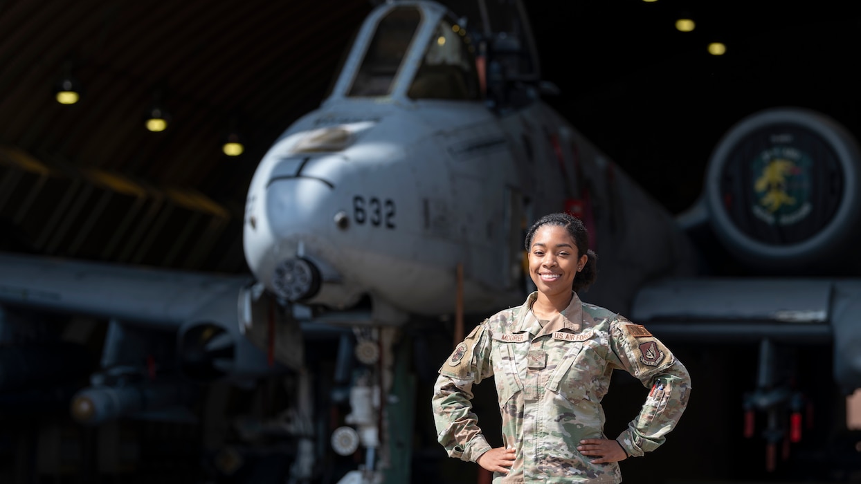 U.S. Air Force Senior Airman Erykah Moorer, 25th Fighter Squadron squadron aviation resource manager, poses for a photo in front of an A-10 Thunderbolt II at Osan Air Base, Republic of Korea, Oct. 9, 2024. Moorer was recognized as Osan’s Mustang of the Week for her hard work and dedication to the 25th FS. Her role as a SARM is vital to making sure all 25th FS aircrew are fully trained and prepared to defend the peninsula safely. (U.S. Air Force photo by Staff Sgt. Ashley N. Mikaio)