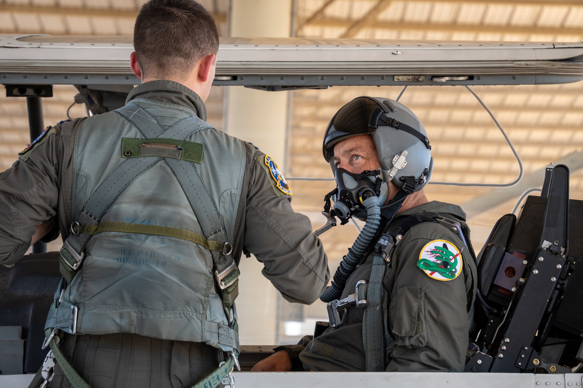 .S. Air Force Chief Master Sgt. Keith Scott, 19th Air Force command chief, is prepped for flight by Capt. Erik Brito