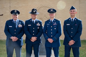 Tech. Sgt. Jacob Urdzik, a Military Training Instructor at the 737th Training Group, poses for a photo following the Basic Military Graduation of his brother, Airman David Urdzik. The brothers are accompanied by their father, Lt. Col. retired Chris Urdzik, and brother, Cadet 3rd Class Samual Urdzik. The Urdzik family is a multigenerational military family where shared values, sacrifice, and pride unite the past, present, and future.