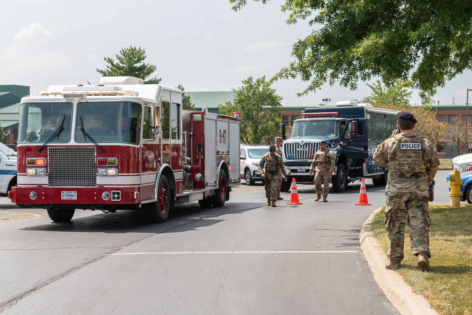 Members of the 123rd Airlift Wing’s security forces and civil engineer squadrons respond to a simulated drone crash during a Readiness Exercise Validation inspection conducted at the Kentucky Air National Guard Base in Louisville, Ky., Aug. 23, 2024. The multi-day exercise tested the wing’s ability to operate in a degraded environment. (U.S. Air National Guard photo by Tech. Sgt. Chloe Ochs)