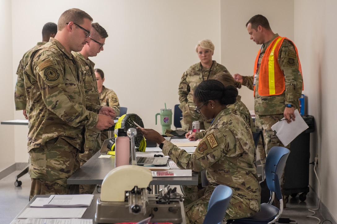 Members of the 123rd Airlift Wing process through a Personal Deployment Function line as part of a Readiness Exercise Validation inspection conducted at the Kentucky Air National Guard Base in Louisville, Ky., Aug. 23, 2024. The multi-day exercise tested the wing’s ability to operate in a degraded environment. (U.S. Air National Guard photo by Airman 1st Class Annaliese Billings)