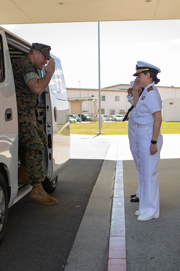 U.S. Navy Cmdr. Jacqueline Lopez, right, the officer in charge of Navy Medicine Readiness and Training Unit and a native of Texas, salutes U.S. Marine Corps Col. Richard Rusnok, left, the commanding officer of Marine Corps Air Station Iwakuni and a native of Pennsylvania, during a Naval Family Branch Clinic tour at MCAS Iwakuni, Japan, Sep. 18, 2024. This event was held to build relations with the members of the Japan Maritime Self-Defense Force from the Kure naval base and provide an opportunity to showcase the capabilities of the clinic. (U.S. Marine Corps photo by Lance Cpl. Dahkareo Pritchett)
