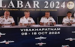Indian Navy Vice Adm. Rajesh Pendharkar (center right), flag officer commanding-in-chief, Eastern Naval Command, speaks alongside senior leaders from the Japan Maritime Self-Defense Force (JMSDF), Royal Australian Navy and U.S. Navy during the opening ceremony for Exercise Malabar 2024 on board Indian Navy Submarine Base Virbahu in Visakhapatnam, India, Oct. 9, 2024.
