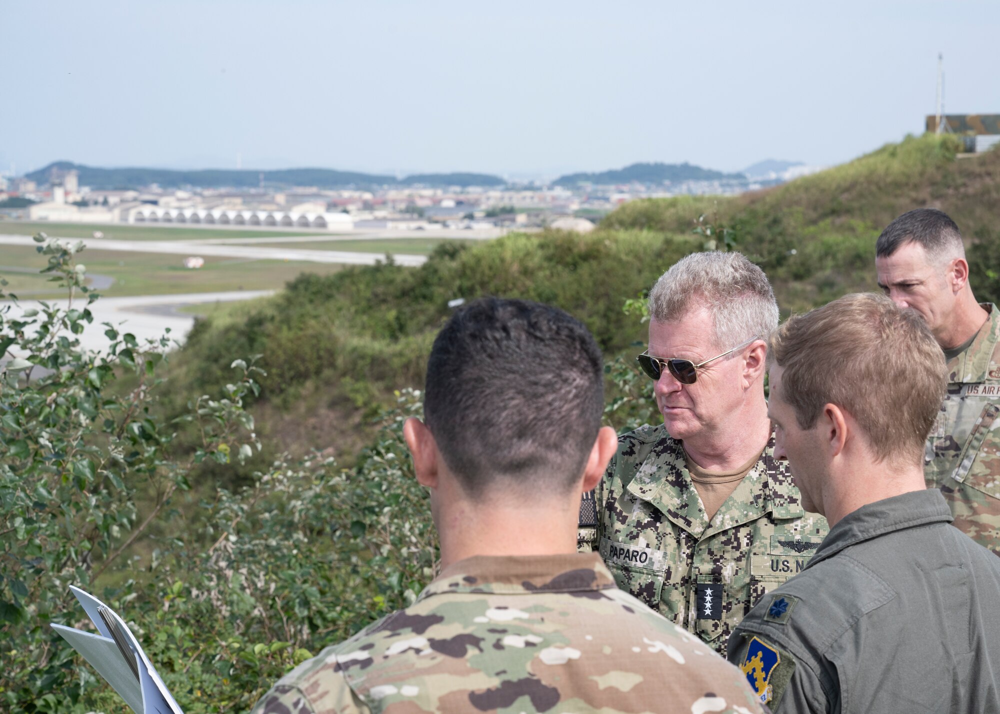 U.S. Air Force Lt. Col. Mark Jaszczak, 8th Operations Support Squadron commander, briefs U.S. Navy Adm. Samuel J. Paparo, U.S. Indo-Pacific Command commander, on the Saemanguem construction project.