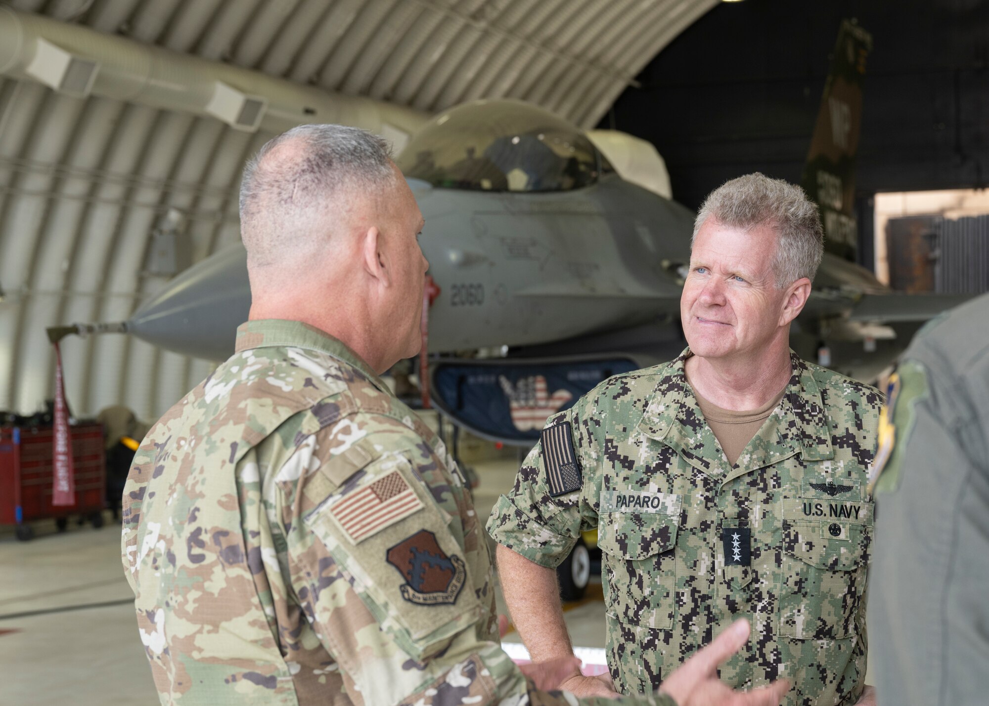U.S. Air Force Col. Casey Crabill, 8th Maintenance Group commander, briefs U.S. Navy Adm. Samuel J. Paparo, U.S. Indo-Pacific Command commander, and Lt. Gen David Iverson, 7th Air Force commander, on the super squadron concept during a base visit.