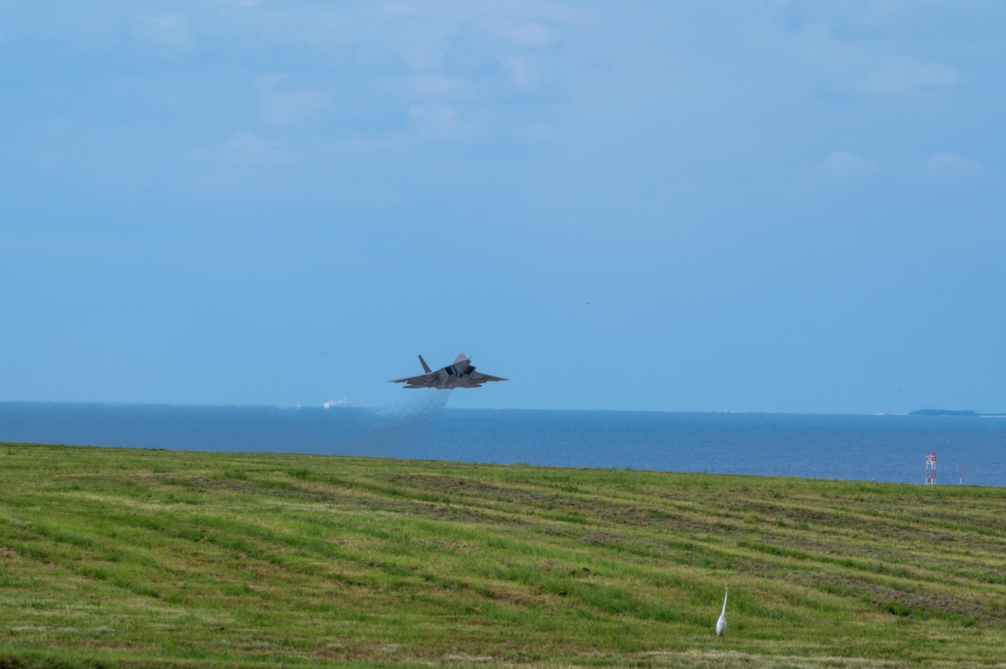 A U.S. Air Force F-22A Raptor, assigned to the 525th Expeditionary Fighter Squadron, Joint Base Elmendorf–Richardson, Alaska, takes off during a temporary deployment at Kadena Air Base, Japan, Oct. 10, 2024.