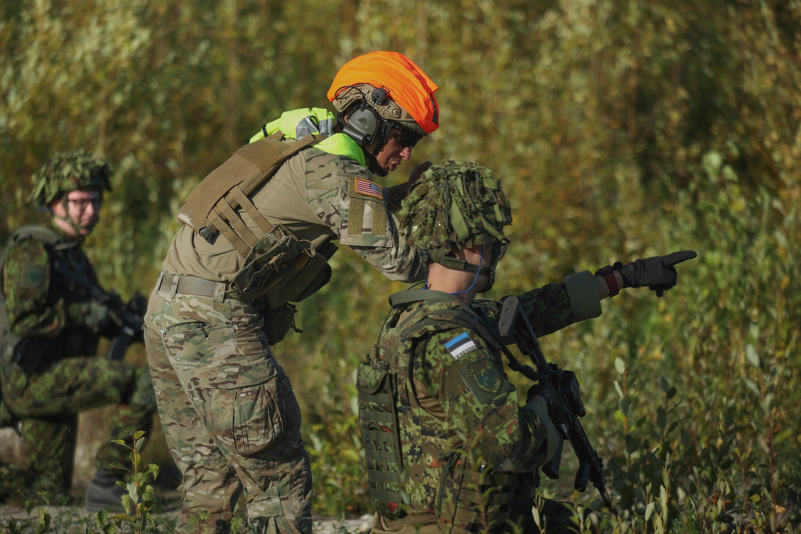 Maryland Army National Guard Sgt. Conner McClaskey, an infantryman with the 1-175th Infantry Regiment, speaks with a member of the Estonian Defense League during training exercise USSISONAD24 Sept. 8, 2024, at Sirgala live-fire range in Sirgala, Estonia. The joint exercise was planned and executed through the National Guard’s State Partnership Program, supporting U.S. European Command’s mission.