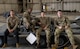 Airmen assigned to the 69th Bomber Generation Squadron pose for a group photo before a third-quarter load competition at Minot Air Force Base, Oct. 4, 2024. The load competition is held quarterly and ensures operational readiness. (U.S. Air Force photo by Airman 1st Class Wesley Davies)