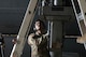 Senior Airman Christo Jose, 23rd Bomber Generation Squadron load team member, observes for safety while his teammates attach an inert GBU-31 to the underside of a B-52H Stratofortress wing at Minot Air Force Base, Oct. 4, 2024. In order to safely load the inert GBU-31 onto the aircraft, two Airmen are needed to attach it to the aircraft while another supervises to ensure safety. (U.S. Air Force photo by Airman 1st Class Wesley Davies)