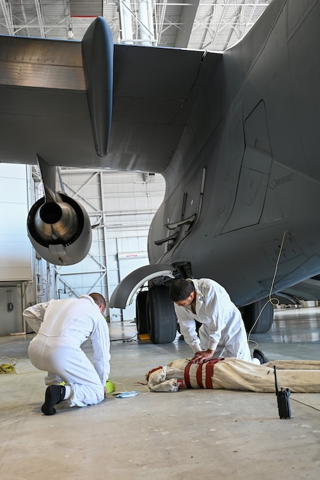 Staff Sgt. Ryan Collier and Senior Airman David Asterino, 445th Maintenance Squadron fuels systems specialists, administer CPR to a simulated unresponsive person during the unit’s organizational rescue team training exercise at Wright-Patterson Air Force Base, Ohio, Sept. 15, 2024.