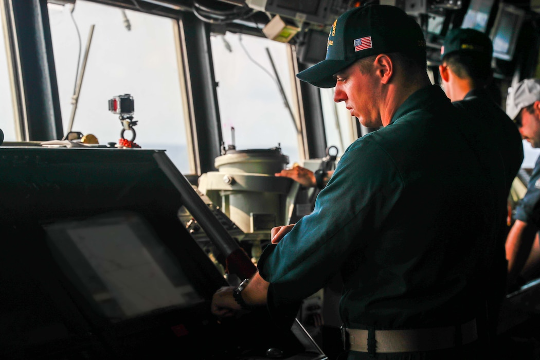 An officer stands watch aboard USS Michael Murphy (DDG 112) in U.S. 5th Fleet.