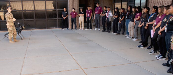 Students from Eldorado High School watch a 99th Security Forces Squadron robot dog demonstration