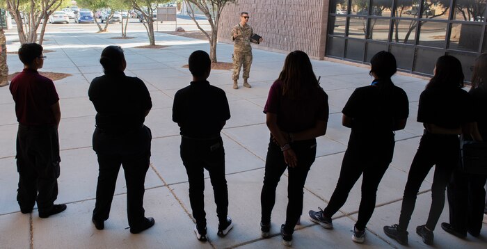 Students from Eldorado High School, listen to a briefing during a tour at Nellis Air Force Base