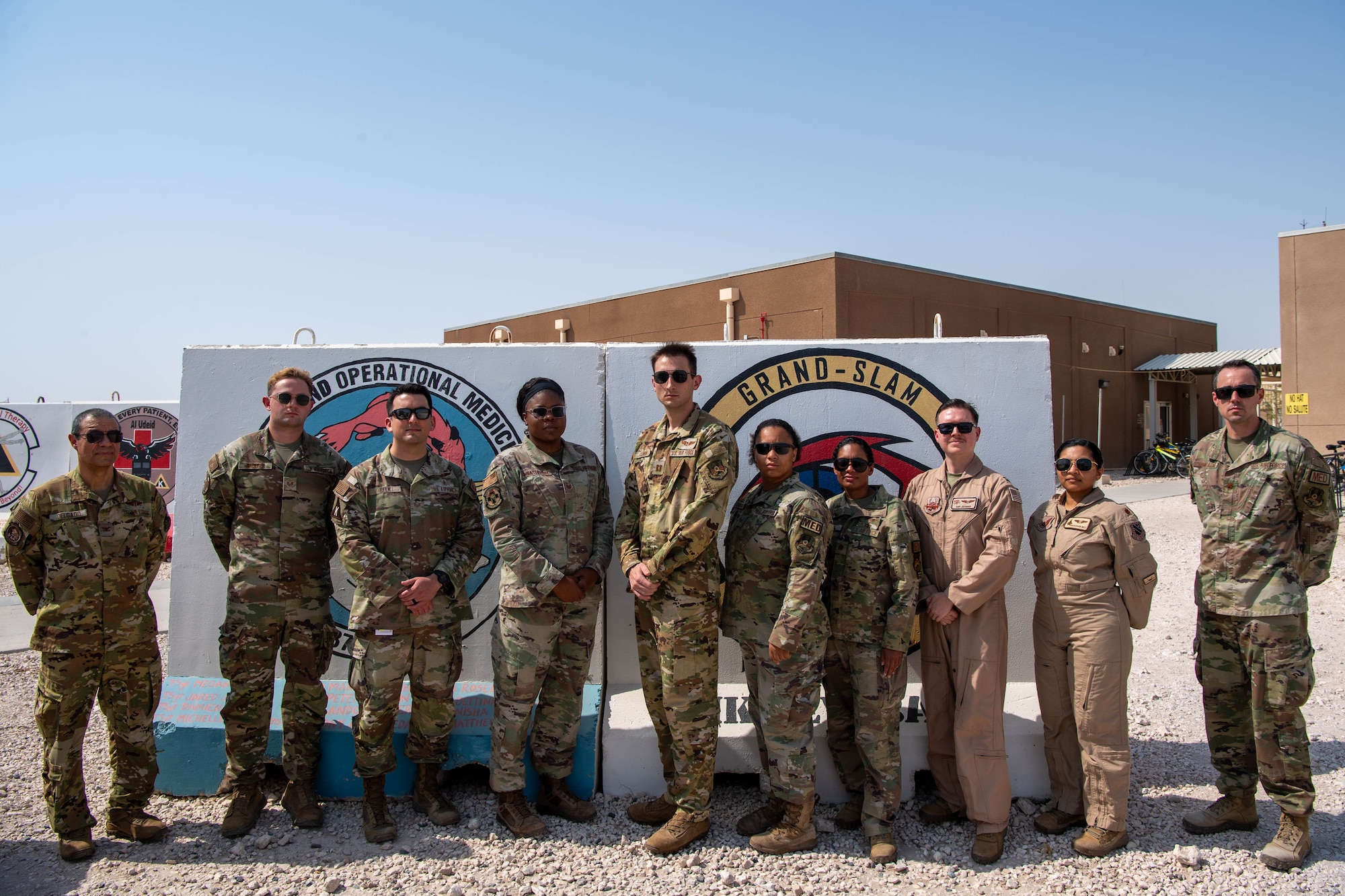 Members of the 379th Expeditionary Medical Squadron flight medicine clinic pose for a photo within the U.S. Central Command area of responsibility, Aug. 31, 2024. The flight medicine team broke new ground with host nation partners, introducing a Qatar Emiri Air Force hyperbaric chamber now available to U.S. personnel. (U.S. Air Force photo)