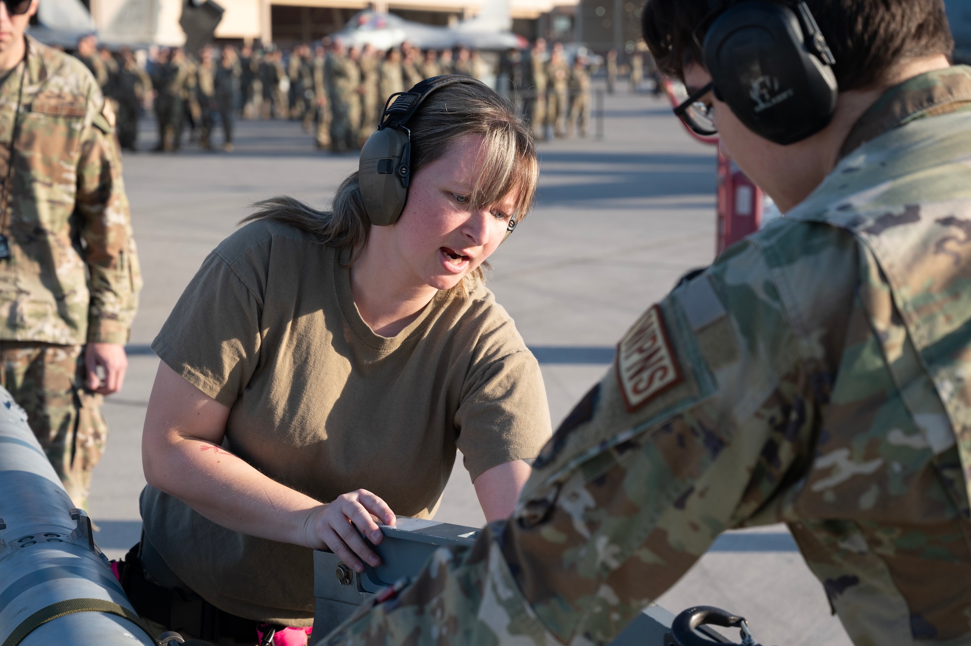 an F-35 Lightning II load crew member prepares an inert missile to load onto an F-35A during the Quarterly Weapons Load Competition