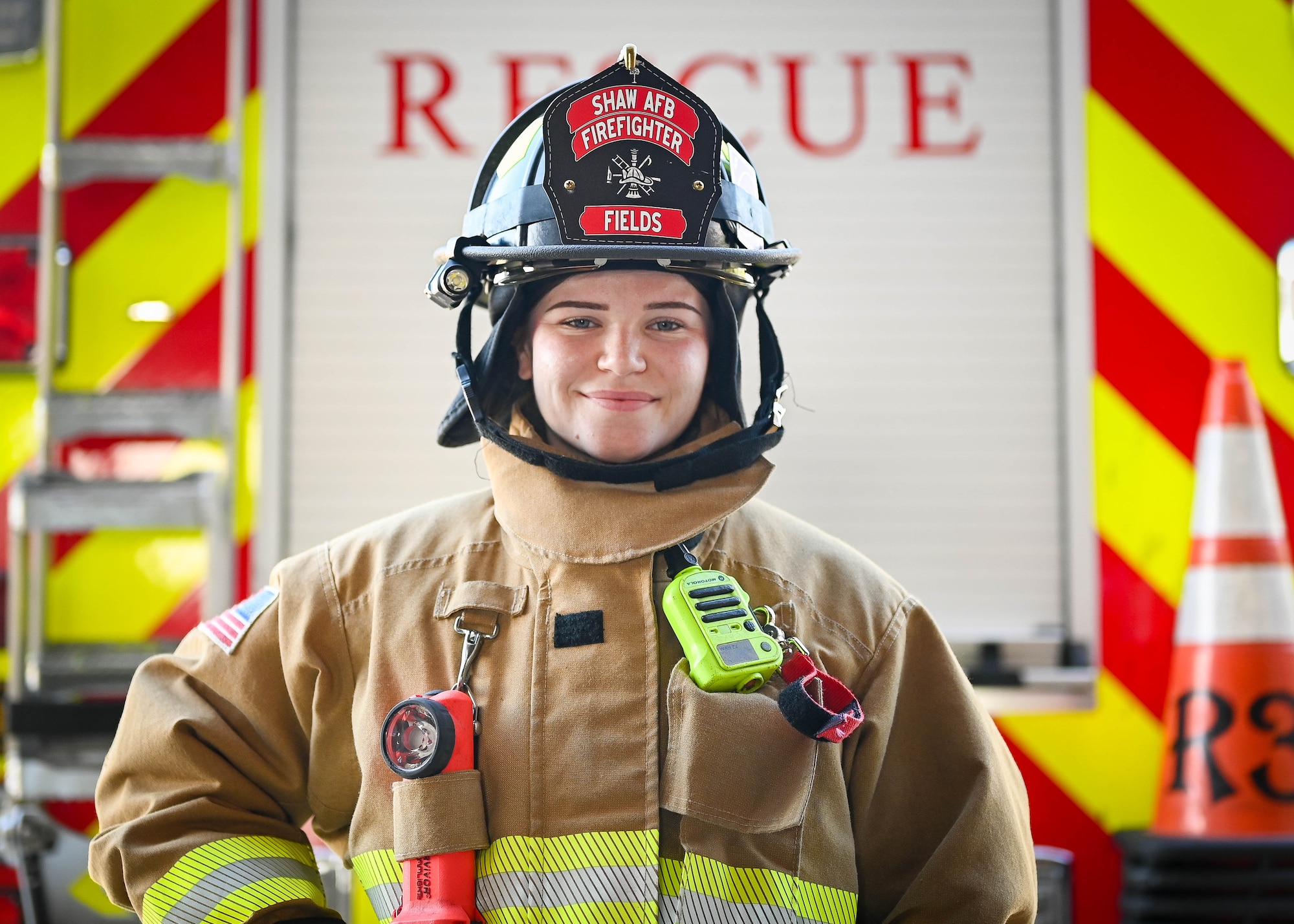 A firefighter poses for a photo.