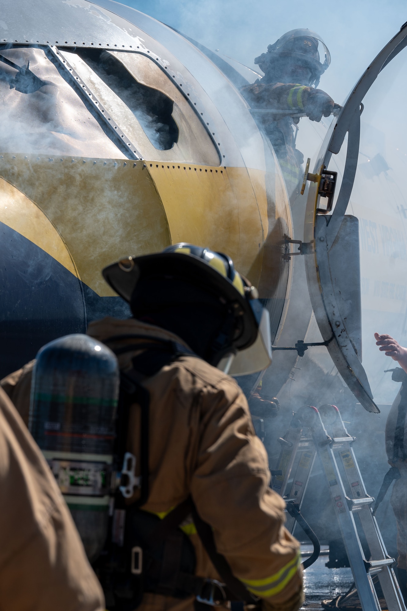 U.S. Airmen assigned to the 130th Fire and Emergency Services extinguish flames in a simulated plane fire during the major accident response exercise (MARE) on October 05, 2024 at Charleston, W.Va. Team Charlie West trains alongside its strategic partners at West Virginia International Yeager Airport during the MARE, the Federal Aviation Administration requires airports every three years to perform this training to operate commercial aircraft. (U.S Air National Guard photo by Staff Sgt. Takara Williams).