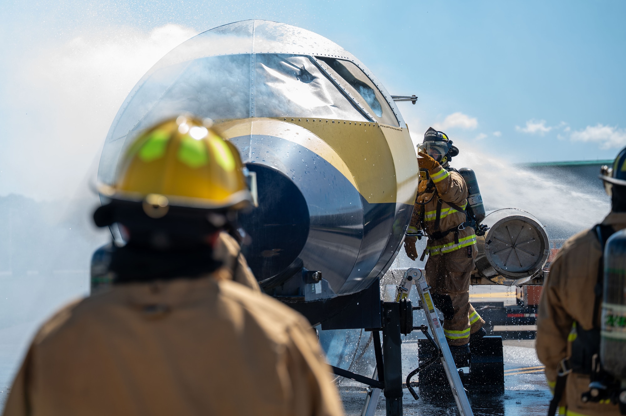 U.S. Airmen assigned to the 130th Fire and Emergency Services prepare to enter a simulated lodge fire during the major accident response exercise (MARE) on October 05, 2024 at Charleston, W.Va. Team Charlie West trains alongside its strategic partners at West Virginia International Yeager Airport during the MARE, the Federal Aviation Administration requires airports every three years to perform this training to operate commercial aircraft. (U.S Air National Guard photo by Staff Sgt. Takara Williams).