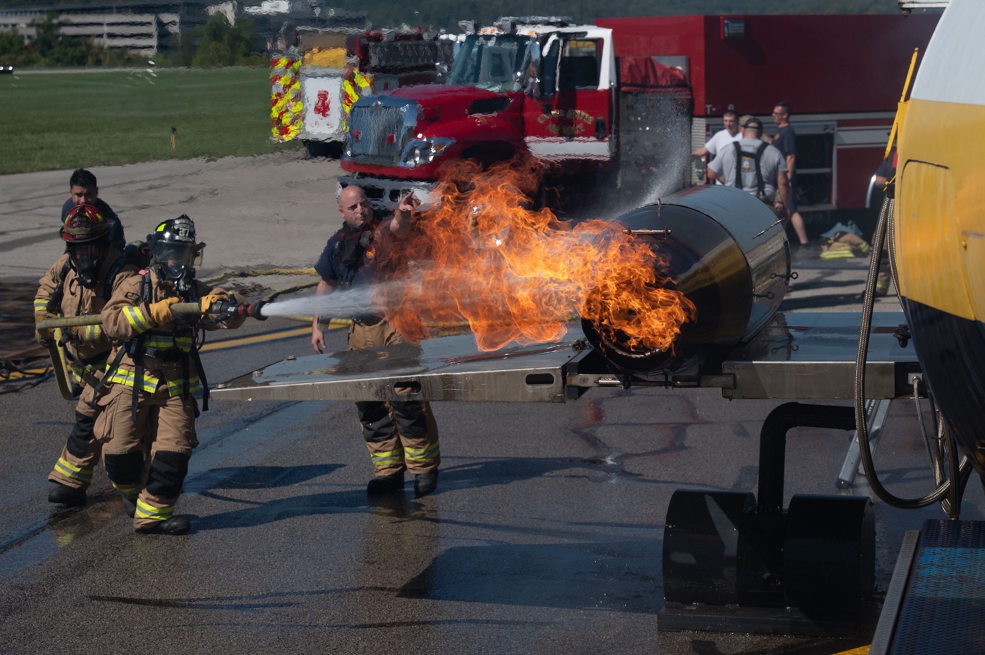 U.S. Airmen assigned to the 130th Fire and Emergency Services extinguish a simulated engine fire during the major accident response exercise (MARE) on October 05, 2024 at Charleston, W.Va. Team Charlie West trains alongside its strategic partners at West Virginia International Yeager Airport during the MARE, the Federal Aviation Administration requires airports every three years to perform this training to operate commercial aircraft. (U.S Air National Guard photo by Staff Sgt. Takara Williams).