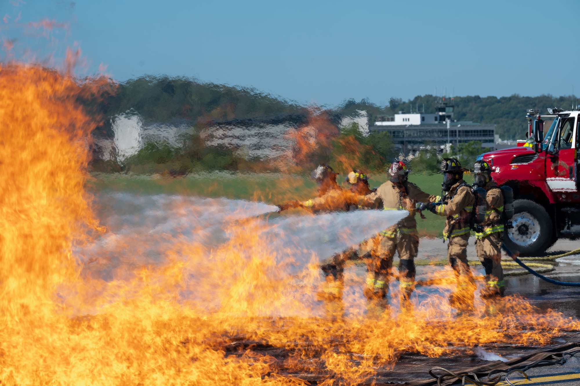 Airmen assigned to the 130th Fire and Emergency Services and members of the Charleston Fire Department prepare to move a simulated patient to a nearby staging area during the major accident response exercise (MARE) on October 05, 2024 at Charleston, W.Va. Team Charlie West trains alongside its strategic partners at West Virginia International Yeager Airport during the MARE, the Federal Aviation Administration requires airports every three years to perform this training to operate commercial aircraft. (U.S Air National Guard photo by Staff Sgt. Takara Williams).