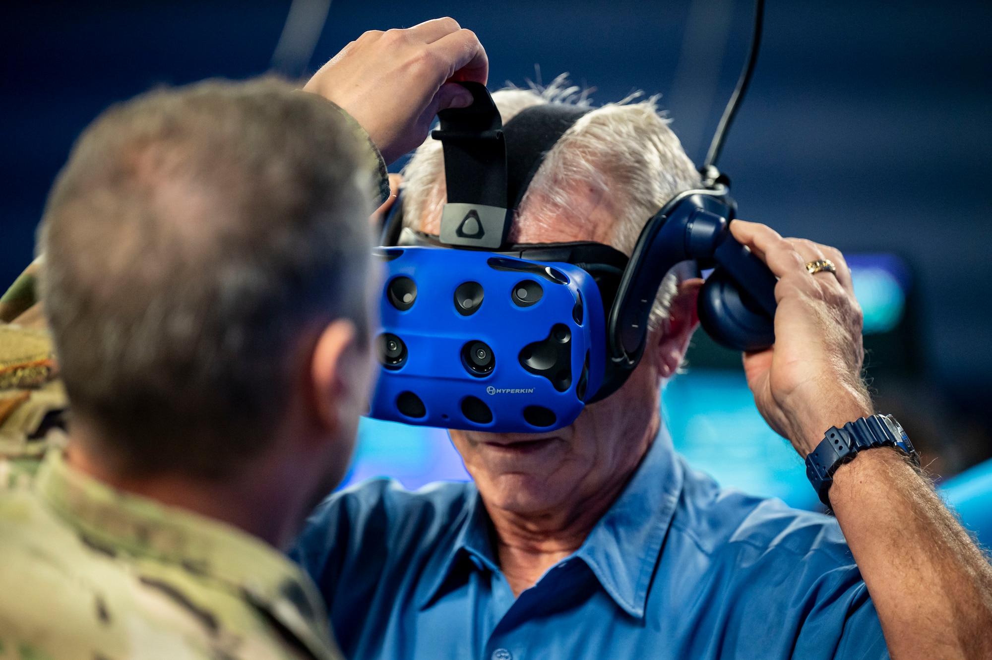 Honorary commander wears a virtual reality headset