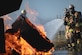 From left, Michael Melson, 316th Civil Engineer Squadron battalion chief, U.S. Air Force Col. Jun S. Oh, 316th Wing and installation commander, and Staff Sgt. Michael Coleman, a lead firefighter assigned to the 316th CES, suppress a fire during a live fire exercise at Joint Base Andrews, Md., Oct. 7, 2024. The exercise was a part of Fire Prevention Week events that highlighted the importance of awareness, education and community involvement in reducing fire risks. (U.S. Air Force photo by Staff Sgt. Alex Broome)