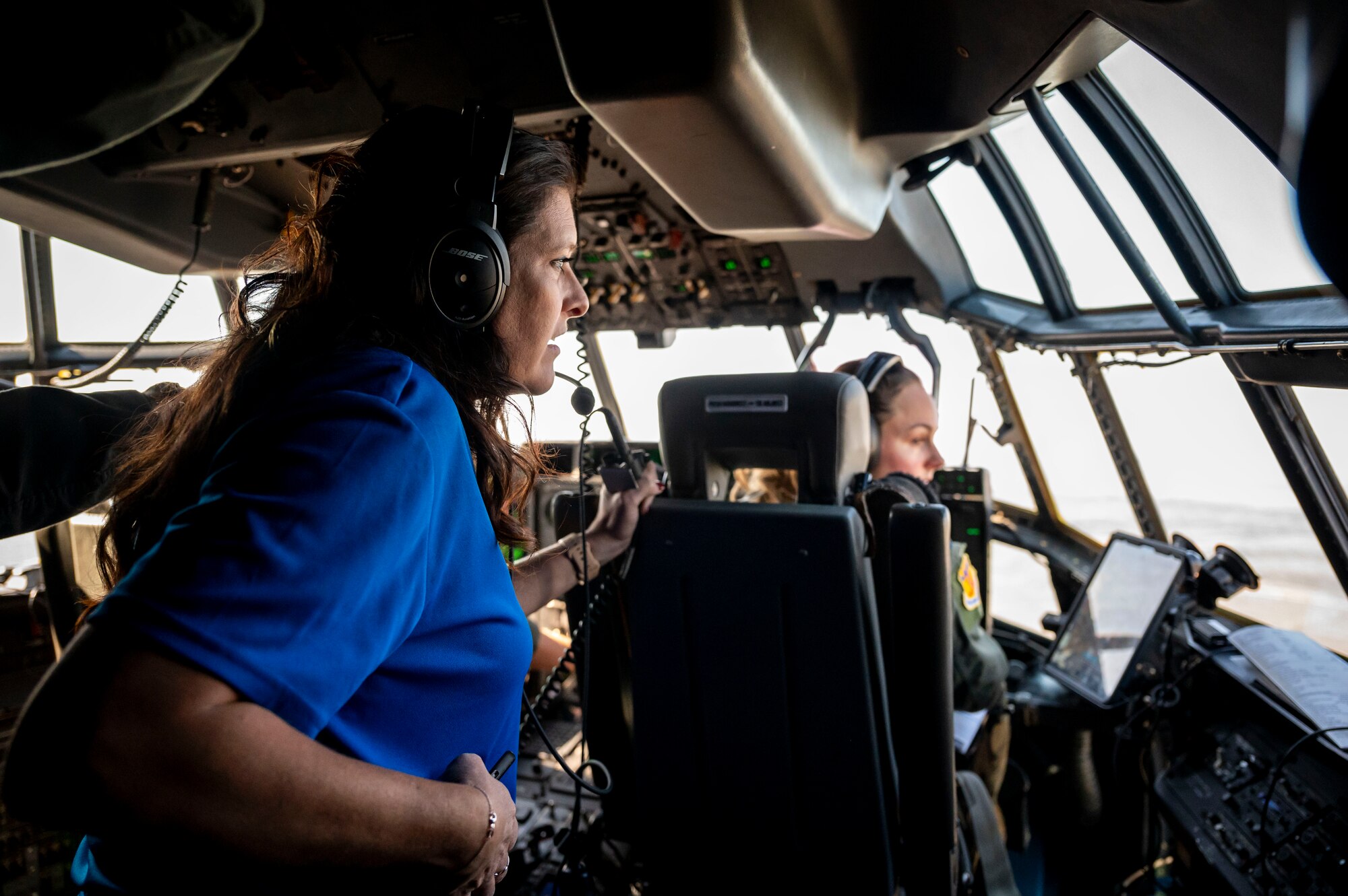 people sit in the cock-pit of a C-130J
