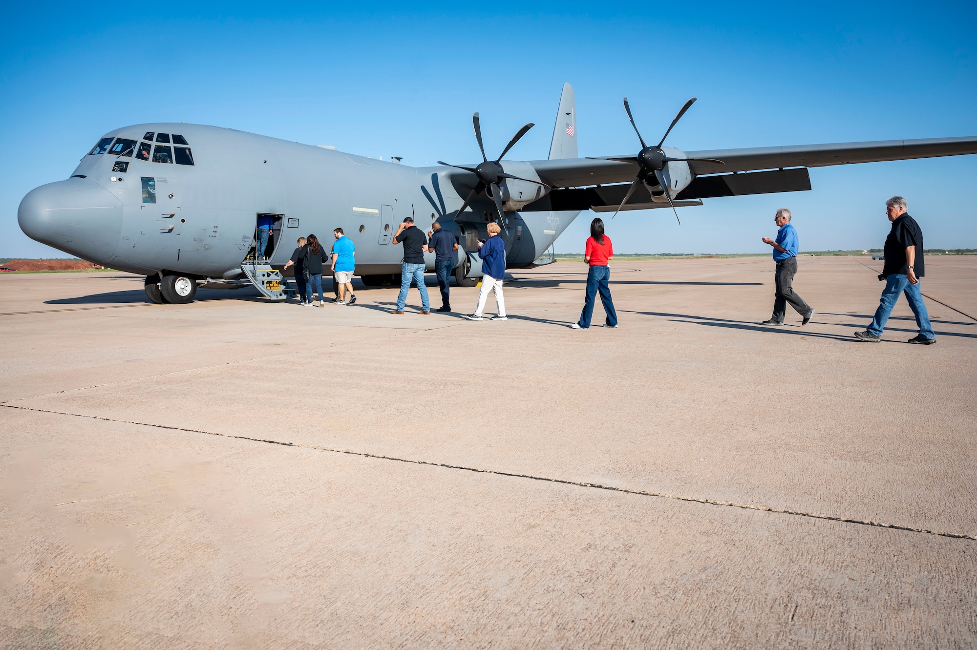 people walk on to a C-130J