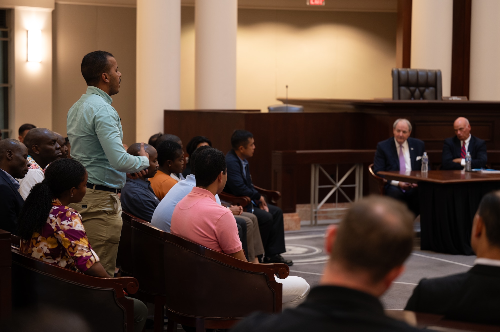 A student from the International Officer School addresses a panel of subject matter experts at the Alabama Supreme Court in Montgomery, Alabama, Oct. 04, 2024. The panel consisted of experts on the U.S. Judicial System who spoke to the students as part of the school's Field Study Program. (U.S. Air Force photo by Senior Airman Evan Porter)
